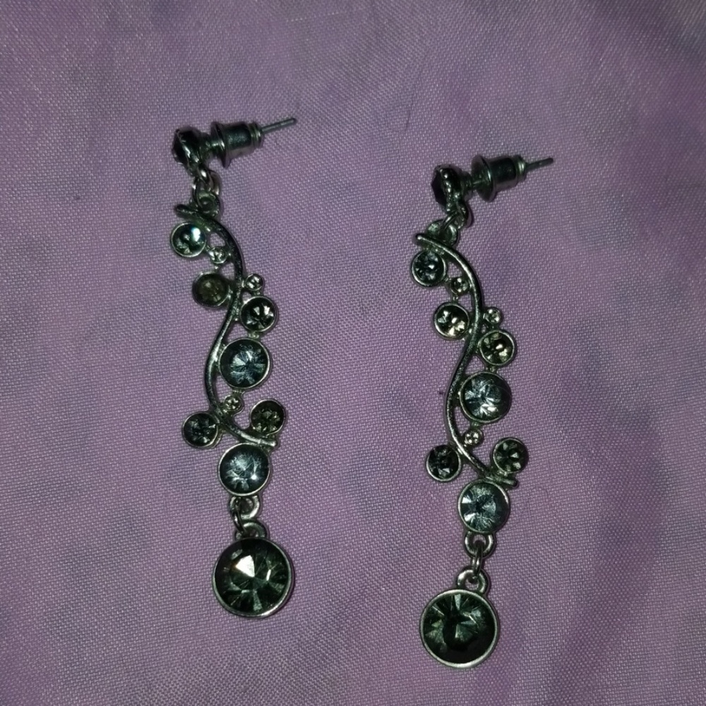 Silver tone with slight pure tint stones.